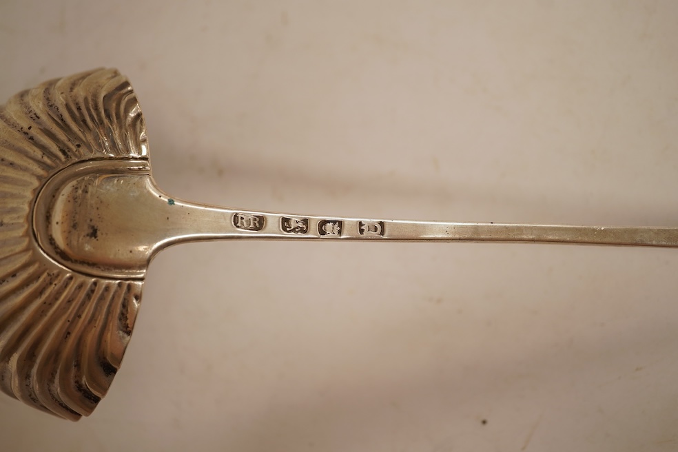 A late George II silver feather edge Old English pattern soup ladle, with fluted bowl, by Richard Rugg, London, 1759, 34cm, 5oz.